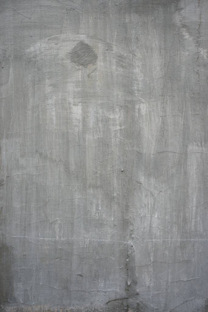 Gammal grå betongvägg