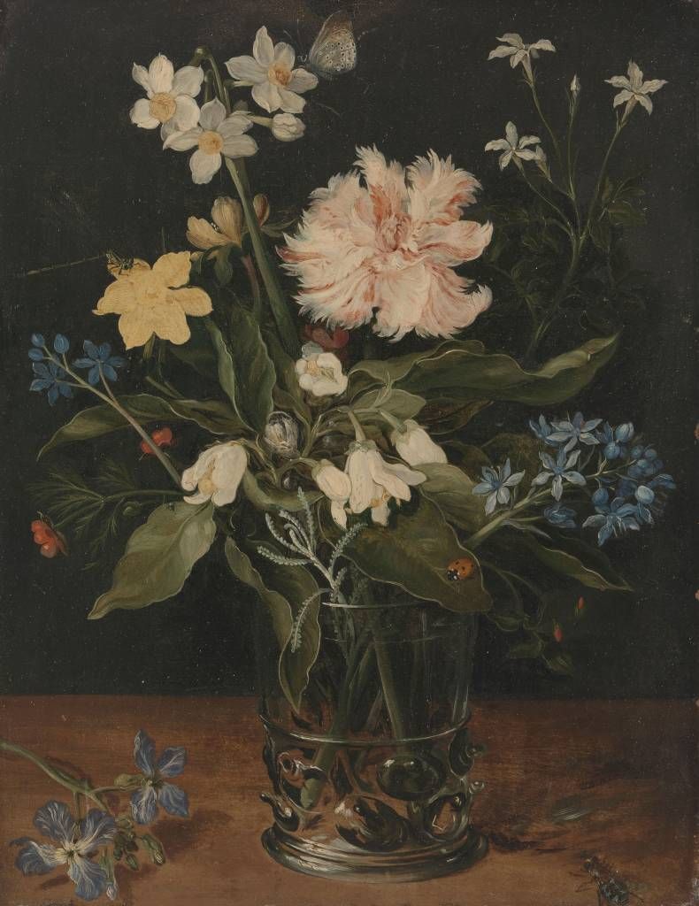 stilleben med blommor i ett exponeringsglas