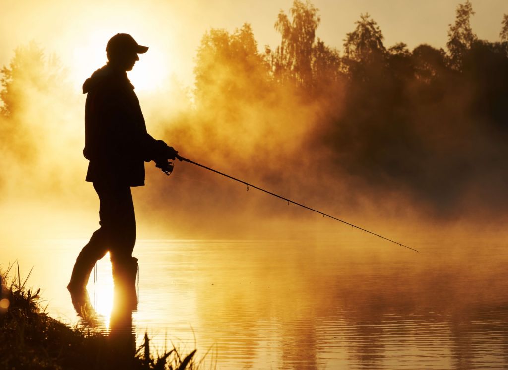 Fiskare vid soluppgång