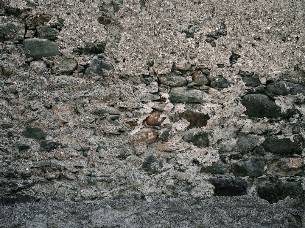 Mur med gamla stora stenar