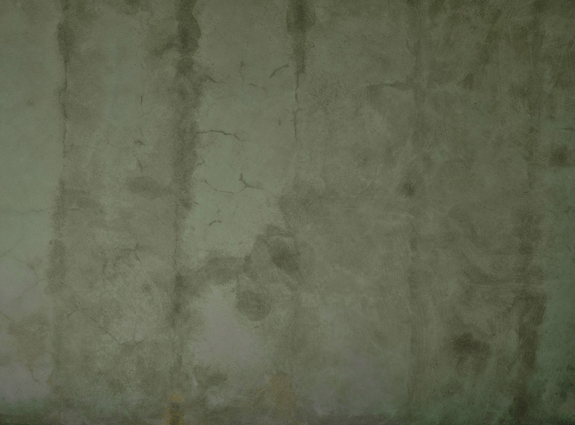 Grønn betong med sveiper sprekker